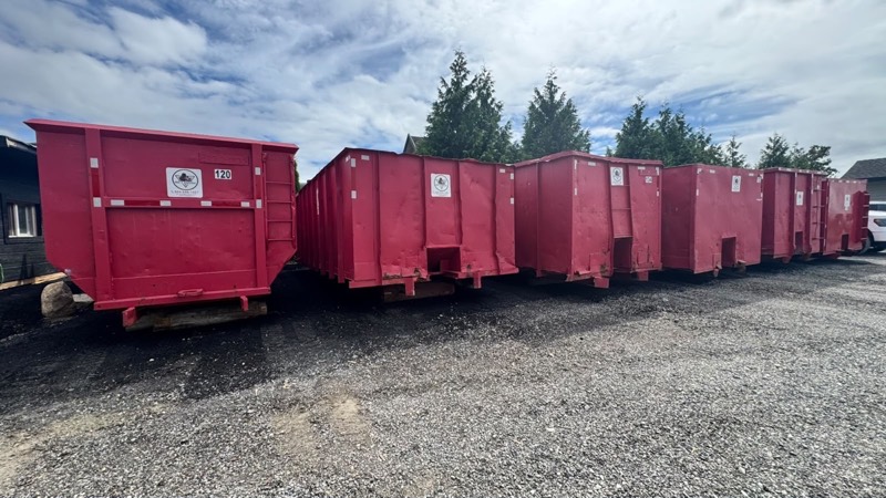 A row of Eric's Disposal bins at the Surrey yard