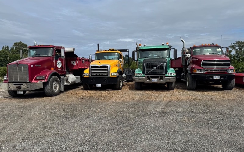 Eric's Disposal's fleet of roll off trucks lined up at the Surrey yard